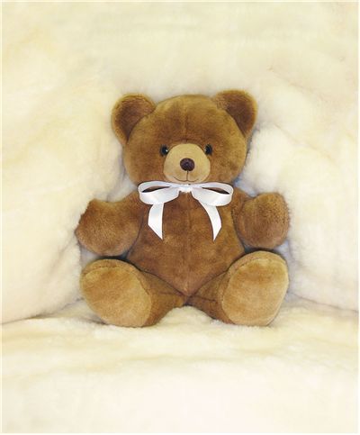 teddy bear on bed
